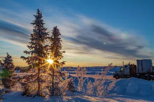 Vehicles Prints: Heavy trucks travel on the ice road over Great Slave Lake in Northwest Territories