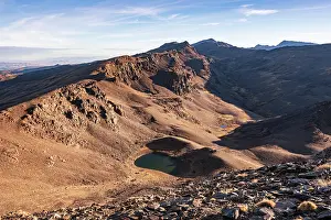 Ecosystems Prints: High-altitude lake surrounded by rocky ridges in Sierra Nevada mountains in Spain near Granada