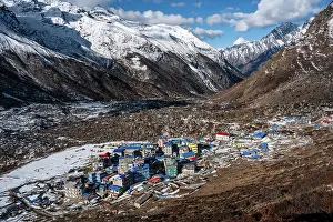 Himalayan Prints: High-angle view of colorful buildings in Kyanjin Gompa village nestled in the snow-dusted Langtang Valley
