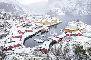 Nordland Gallery: High angle view of traditional fishermens cabins and harbor covered with snow, Nusfjord, Nordland