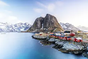 Hamnoy Prints: High angle view of traditional red Rorbu cabins in the fishing village of Hamnoy at dawn