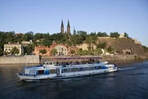 High Castle (Vysehrad) and river boat on Vltava River, Prague, Czech Republic, Europe