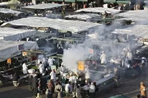 Images Dated 6th December 2008: High view of food stalls, cooking and people in Djemma el Fna square in early evening in the Medina