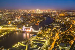 Canary Wharf Prints: High view of London skyline at night along the River Thames from Tower Bridge to Canary Wharf