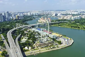 High view over Singapore with the Singapore Flyer ferris wheel and ECP expressway