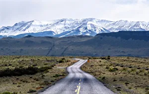 Highway Prints: Highway leading to snow covered mountains