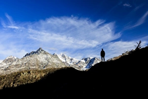 Images Dated 18th October 2009: Hiker admires Monte Disgrazia from Lake Mufule, Malenco Valley, Province of Sondrio