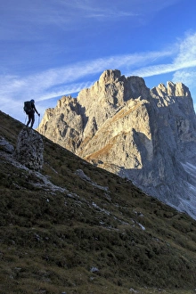 Odle Prints: Hiker admires the rocky peaks Furcella De Furcia, Odle, Funes Valley, South Tyrol