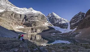 Canadian Culture Prints: Hiker couple enjoying the view of Lake Oesa on the Alpine Circuit Trail at Lake O Hara