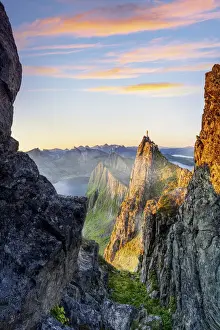 40 45 Years Prints: Hiker man admiring sunrise standing on top of Husfjellet mountain, Senja, Troms county
