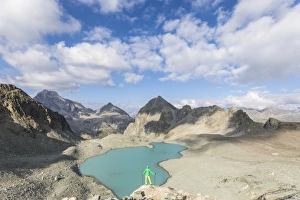 The Great Outdoors Prints: Hiker on the rocks overhanging Lej Lagrev, Silvaplana, Engadine, Canton of Graubunden