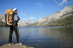 Images Dated 5th October 2006: A hiker takes in the view on the shore of Tenaya Lake, in the Tuolumne Meadows