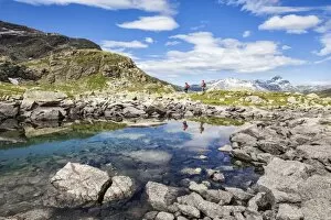 Images Dated 8th August 2010: Hikers admire the view at Lake Grevasalvas, Engadine, Canton of Grisons (Graubunden)