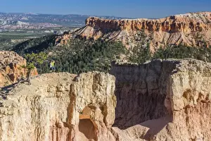 Rock Cliffs Prints: Hikers on arch rock formation in Bryce Canyon Amphitheater