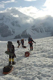 Images Dated 14th June 2009: Hikers break with Mount Foraker on the left and Mount Crosson on the right