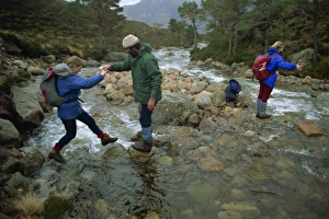Walker Prints: Hikers crossing river in the Ben-Damph Hills