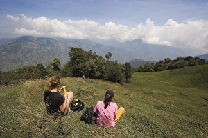 Images Dated 30th January 2005: Hikers enjoy the view on the verdant slopes of the active Tungurahua Volcano that threatens