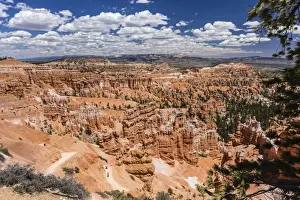 Hoodoo Prints: Hikers amongst hoodoo formations on the Sunrise Point Trail in Bryce Canyon National Park