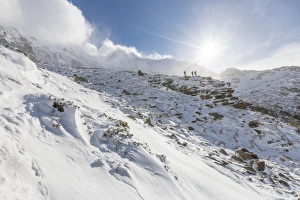 The Great Outdoors Prints: Hikers proceed in the snowy valley of Alpe Fora, Malenco Valley, Province of Sondrio