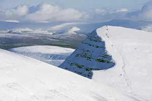 Hiker Prints: Hikers on snow covered Pen y Fan mountain, Brecon Beacons National Park
