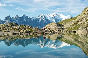 Rural Scenes Gallery: Hikers and the summit of Mont Blanc reflected in Lac Blanc on the Tour du Mont Blanc