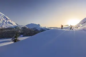 Unrecognisable Person Prints: Hikers venturing over the frozen lakes of the Engadine where you can enjoy an exceptional view