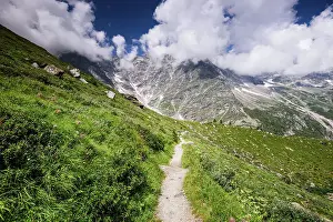 Outdoor Activities Prints: Hiking trail in alpine landscape facing Monte Rosa with moraine landscape