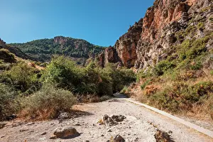 Hiking trail in the arid gorge canyon landscape of Los Cahorros Monachil, Monachil, Sierra Nevada, Granada, Andalusia, Spain, Europe