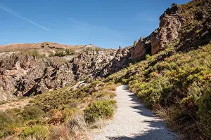 Fitness Prints: Hiking trail in the arid gorge canyon landscape of Los Cahorros Monachil