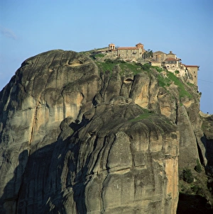 Rock Cliff Prints: Hill of bare rock on top of which is the Holy Monastery