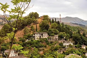 Albania Prints: Hillside homes surrounded by greenery and mountains in Gjirokastr County