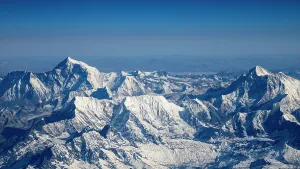 Trekking Prints: Himalaya mountain range seen from the air in Nepal showcasing snow and rock formations at high altitude
