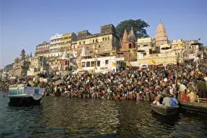 River Bank Prints: Hindu pilgrims bathing in the early morning in the holy river Ganges