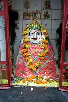 Human Representation Prints: Hindu street shrine, decorated with marigold mala (garlands) for Diwali festival