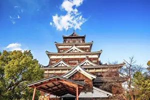 Main Prints: Hiroshima Castle main tower in yellow autumnal leaves. Hiroshima, Japan