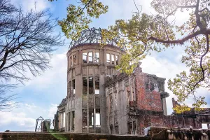 Resilience Prints: Hiroshima, Japan. Atomic Bomb Dome with lush trees in front of it