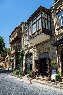Balconies Prints: Historic architecture and local shops in the old city of Baku