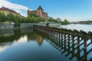 Vltava Prints: Historic Bellevue building and wooden icebreaker on Vltava River