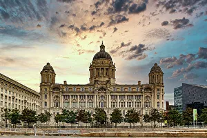 Water Feature Prints: Historic building with domes against a dramatic sunset sky