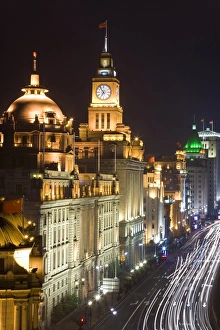 Historic buildings along Shanghais famous Bund promenade, illuminated at night Historic buildings along Shanghais famous Bund promenade, illuminated at night