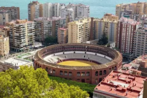 Bullring Prints: Historic bullring in city of Malaga surrounded by high rise apartments