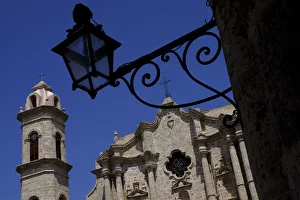 Old Havana Prints: Historic church behind the silhouette of an iron lantern, Old Havana, Cuba, West Indies