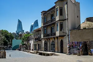 Attractions Prints: Historic city of Baku features old buildings with modern flame towers in the background in Azerbaijan