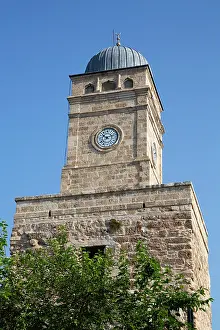 Antalya Prints: Historic clock tower stands tall under blue sky in Antalya