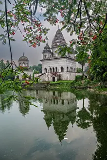 South Prints: Historic Puthia Rajbari Complex reflects in water with trees in view at dusk in Bangladesh