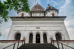 Front Prints: Historic Puthia Rajbari complex stands tall with intricate architecture under the sky in Bangladesh