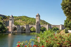 Iconic Prints: Historic stone arch bridge spans the Lot River in Cahors