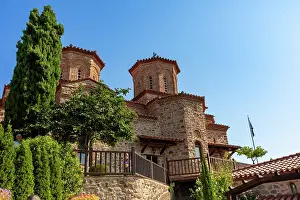 Balconies Prints: Historic stone monastery with twin domes stands in Thessaly