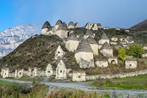 Burial Prints: Historic structures stand on the hillside in Dargavs