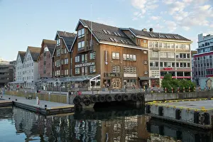 Tromso Prints: Historic wooden buildings with bars and restaurants along harbour waterside